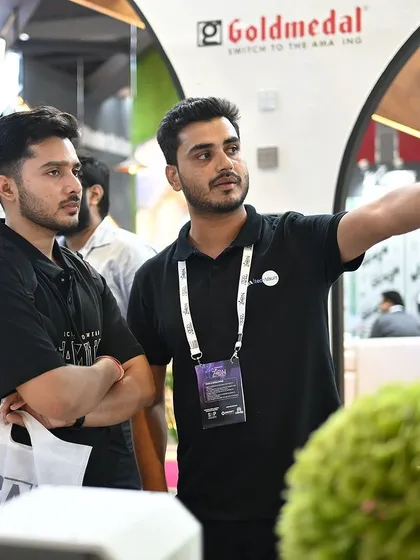 A team member guiding visitors through the exhibition hall. We are always happy to connect and share our passion for technology and design.