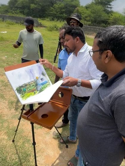 Showing my finished painting to fellow artists who were also painting on location. It's great to share feedback and see different interpretations of the same scene.