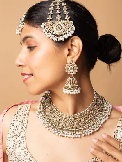 A side profile showcasing the design of the jhumkas and the matching passa. This angle is crucial for customers to see how the pieces look from all sides.