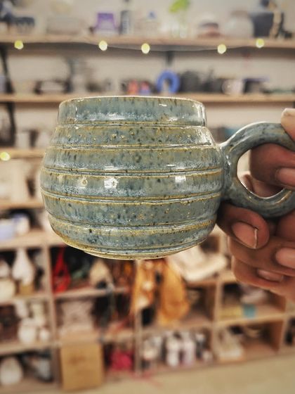 This student created a wonderful variety of forms and textures in her beginner's course, from a marbled Nerikomi bowl to a textured mug with a unique handle.