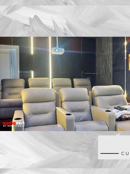 This is your own private miniplex. This image captures a dedicated home cinema we built, featuring plush leather recliners, a massive 120 inch screen, and a complete KEF and SVS surround sound system. We handle everything from the acoustic paneling to the final calibration.