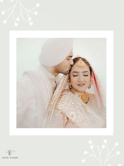 A soft, romantic portrait of the groom kissing the bride's forehead, framed by a delicate white border for an artistic touch.