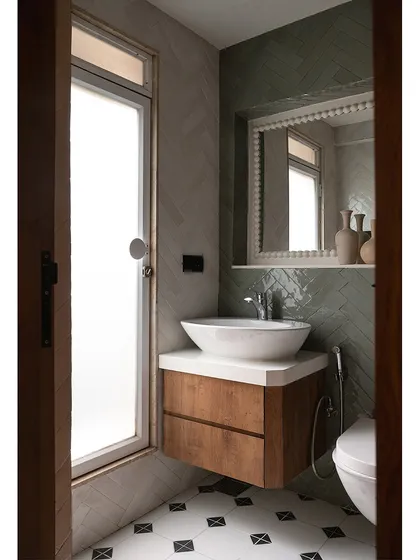 For this bathroom revamp, we reused the client's existing sanitary fixtures but transformed the space with new tiles and a custom vanity. The result is a fresh, modern look that reflects the home's understated aesthetic.