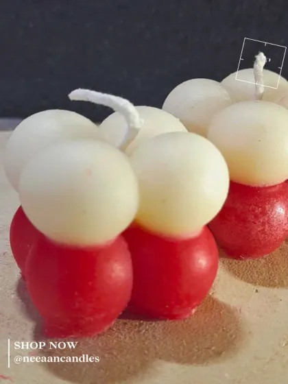 Sweet like candy, but it’s a candle. Our handcrafted red and white bubble candle brings a pop of color and charm.