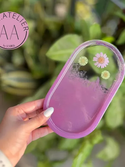 A lovely lilac oval trinket tray. The soft purple color is calming and sophisticated, making it a stylish addition to any room.