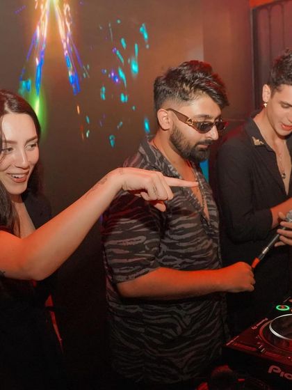 A fun moment with a fan and a saxophonist at Toca.