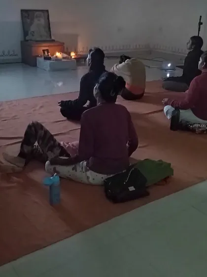 Participants meditating together. The strength of the Sangha lies in these quiet moments of shared stillness and collective seeking.