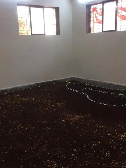 The 'lal mati' pit, freshly prepared and decorated for our akhada's inauguration ceremony. The soil is mixed with ingredients like turmeric and ghee, and is revered by all wrestlers.
