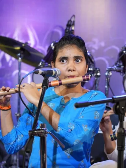 The intense focus of a student playing Swara Geeth in Raag Bhupali on the bansuri.