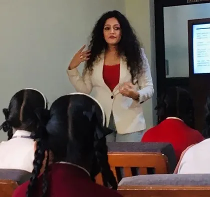 Teaching a group of young women at St. Dominic Savio school about body language. My goal is to empower them with the knowledge of non-verbal communication to help them project confidence.