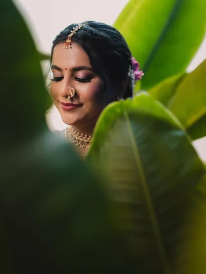 A creative shot of our bride in her yellow and purple Nauvari, showcasing the traditional details of her look.
