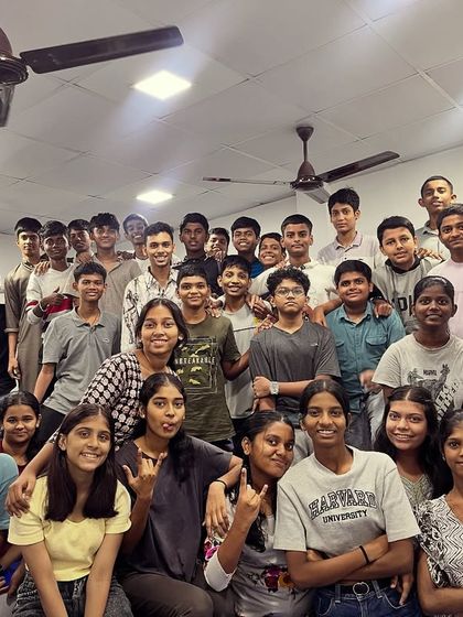 A wide shot of the classroom shows the unity and spirit of our students during the Navratri color-themed days.