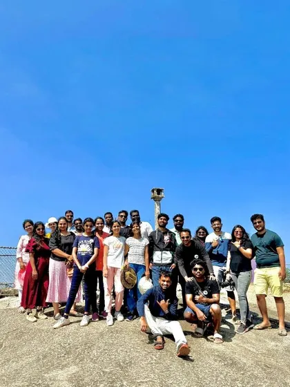 A group photo at a viewpoint, with the clear blue sky making a perfect backdrop.