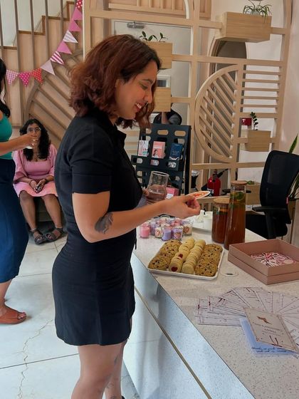 Our team member enjoying the treats at our Galentine's Day event. We believe in keeping things cute with candles, stickers, and cookies.