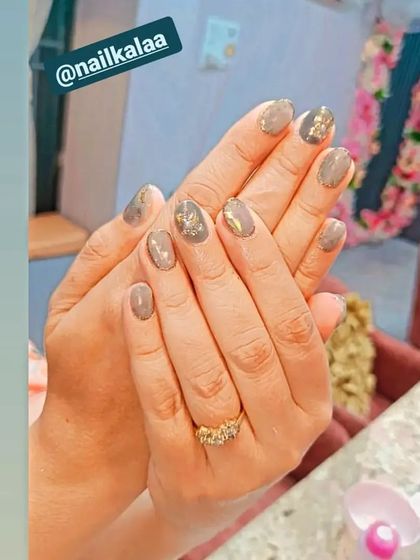 A chic and earthy design with a grey-toned nude base, accented with gold foil and a delicate gold floral stamp.