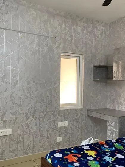 For this room, the goal was a completely unified and modern look. I used the same premium silver-grey textured film to wrap the accent wall, the floating study desk, and the overhead cabinets. This is a perfect solution for creating a custom, built-in feel without expensive carpentry.