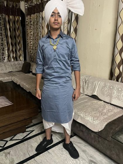 Another one of our talented students who won his school dance competition. He is seen here in a classic Punjabi folk dance costume.