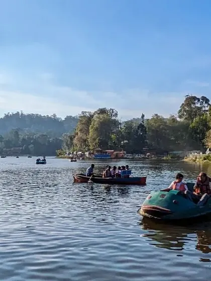 A panoramic view of the bustling Kodaikanal lake, a popular spot on our trip itinerary.