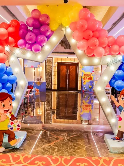 A grand star-shaped entrance arch for Pranaya's Art Party. Flanked by personalized welcome boards showing the birthday girl's milestones, it made for a truly special welcome.