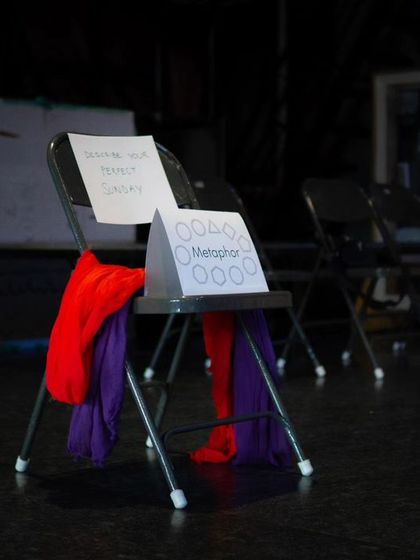 A duplicate image of a chair set up for a workshop, ready for creative exercises.