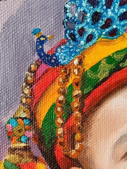 A detail shot of the intricate, colorful turban I painted for the baby Kanha portrait.
