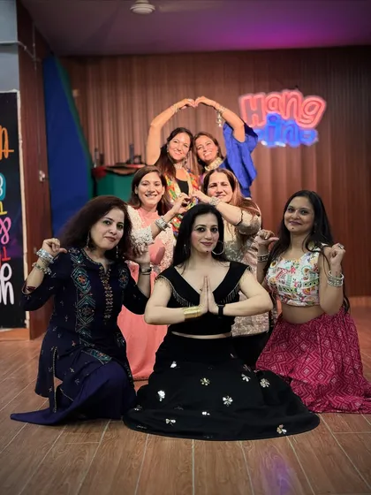 More than just a class, we are a community. A moment of togetherness and shared joy after a fantastic Garba dance session.