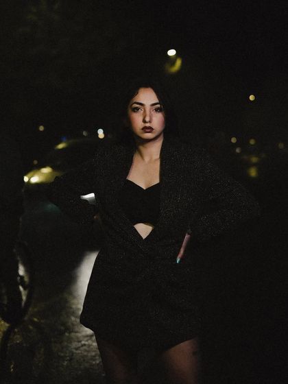 A close-up portrait from the night shoot, with a direct and intense gaze.