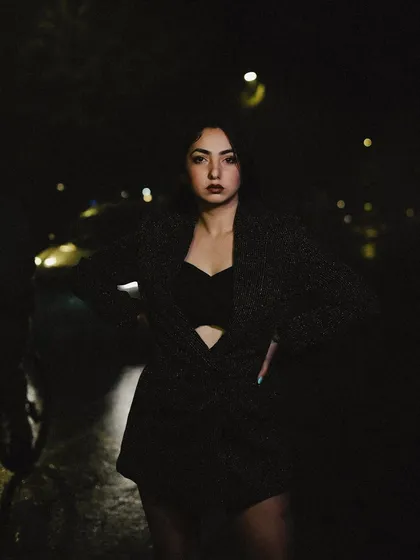 A close-up portrait from the night shoot, with a direct and intense gaze.