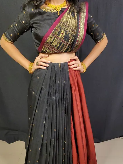 This shows a pre-stitched saree pallu, which can be attached to a lehenga or skirt. It's a versatile option that combines the look of a saree with the ease of a two-piece outfit.