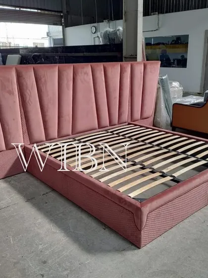 Straight from the factory and all set to go. This custom bed features a dramatic, oversized, channel-tufted headboard in a beautiful dusty pink velvet.