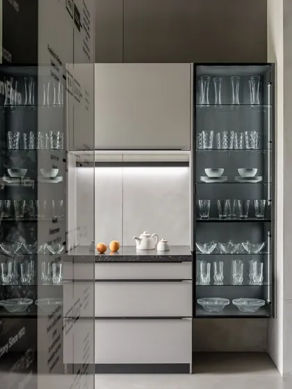 The Ahmedabad showroom, designed by Anarr Gunjaria, features this elegant display with illuminated glass cabinets, creating an environment that feels both elevated and approachable.