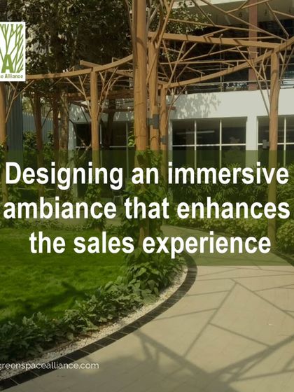 A thoughtfully designed landscape around a sales experience center creates an immersive ambiance. This image shows a pathway shaded by an architectural pergola, guiding potential buyers through a pleasant environment that enhances the sales experience.