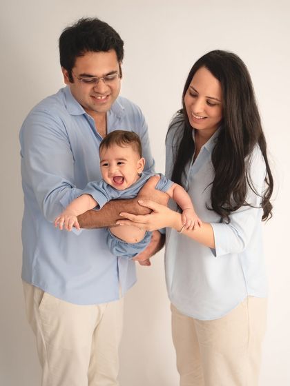 A moment of pure joy and laughter. Playing with your baby during the shoot is the best way to get these wonderfully authentic and happy expressions.