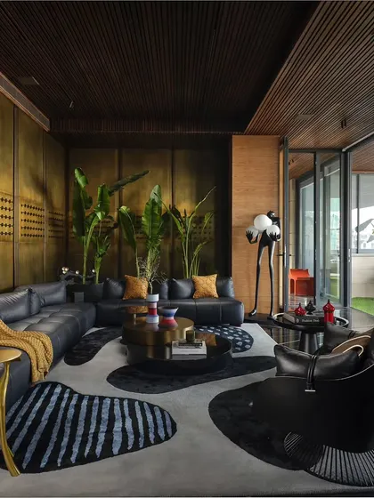 This lounge area is designed to be grand yet simple, airy yet cozy. The material palette of brass, leather, and wood creates an earthy and serene atmosphere, perfect for relaxation and conversation.