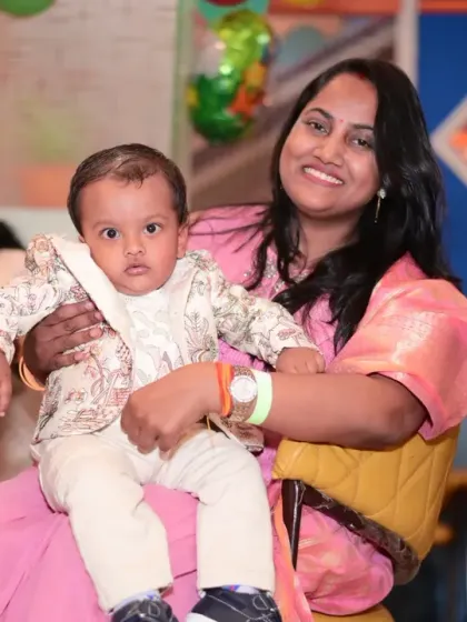 A mother and her baby enjoying the party. We ensure a family-friendly environment for all.