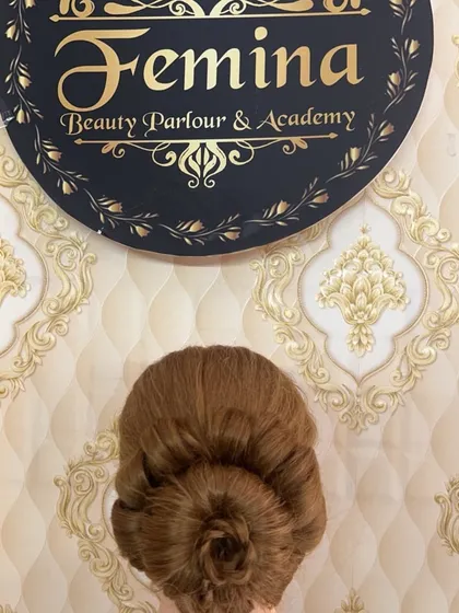 A perfectly executed rose bun. This style is created by twisting and pinning the hair to resemble the petals of a rose.