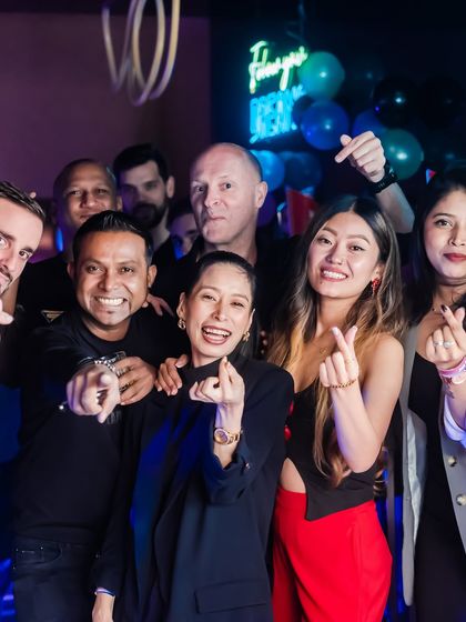 A happy group posing for the camera, showing the fun, social vibe.