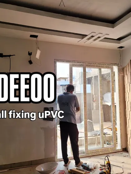 Our team fixing a uPVC window into a porta wall. This highlights a specific step in the process, showing the integration of modern windows into our structures.