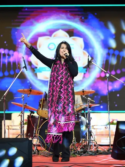 Commanding the stage during a large concert in Pune. My goal is to make sure every single person in the audience feels like a part of the show.