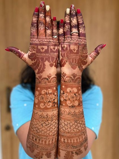 A view of the back of the hands from a Bridal Extravaganza package, showing that the intricacy and beauty extend to every part of the design.