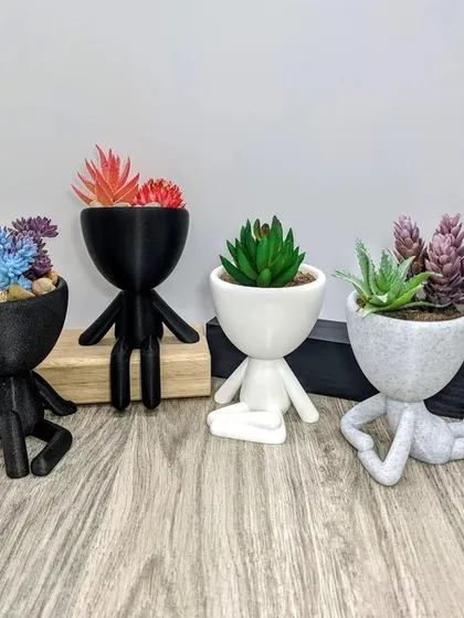 For the yoga lover or anyone who appreciates a bit of whimsy, these human-figure planters are a perfect choice. Each one holds a small succulent and comes in a different relaxed pose.