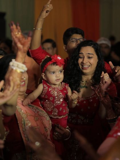 In the middle of the dance floor with Gauri at a family wedding. This candid shot captures the energy and fun of Indian celebrations, showing that being a mom doesn't mean missing out on the masti.