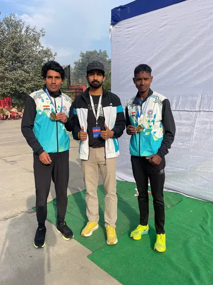 Standing proud with two of my medal-winning athletes after the Alwar Rajasthan Marathon. Their success is a reflection of our collective effort.