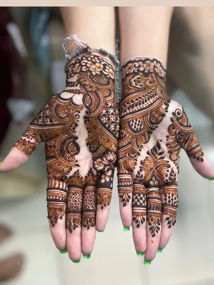 A stunning Indo-Arabic design with a mix of floral and paisley motifs. The patterns are intricate and create a rich, textured look.