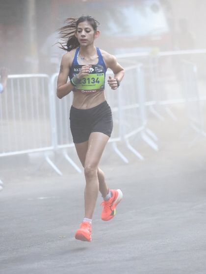 Running through the dust and haze, this shot captures the grit required on race day. It's not always pretty, but it's always powerful. This is what it means to be an endurance athlete.