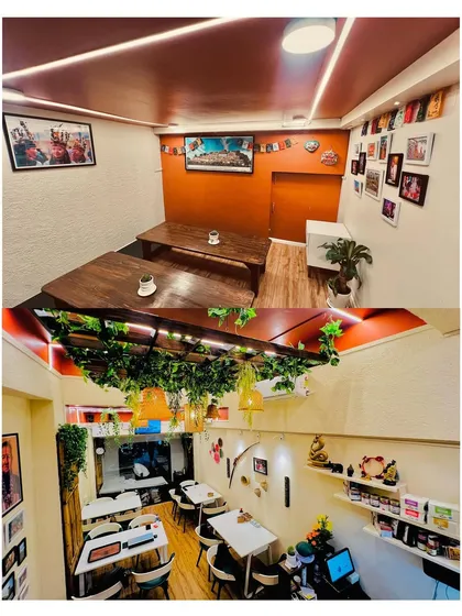 Our dining space is designed to be cozy and intimate. The top image shows our traditional low-seating area for a more authentic experience, while the bottom image gives a view of the main dining floor, decorated with greenery and warm lighting.