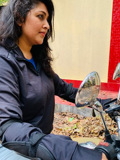 A close-up of a graduate, focused and in control. This is the look of a woman who knows her machine and is ready for the road.