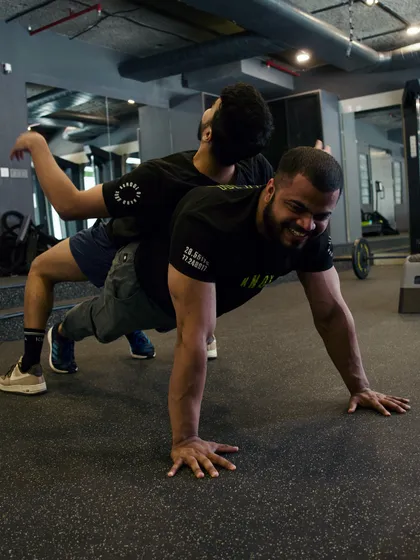 Even coaches have fun. Vinay shares a lighthearted moment with another member, showcasing the fun and supportive community at Knox.