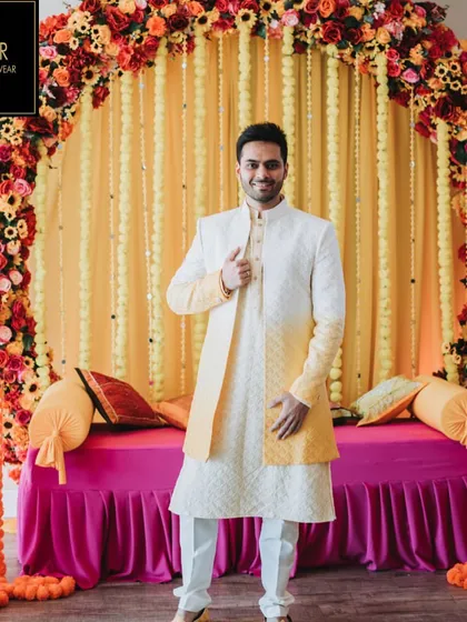 The perfect outfit for a vibrant Haldi ceremony. This client is wearing a custom Indo-Western sherwani with a yellow ombre effect, designed to complement the festive atmosphere while ensuring he looks sharp and feels comfortable.
