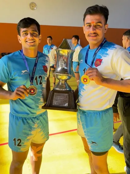 The result of all the mehnat. Two of our senior players proudly display their winners' trophy and medals after a tough championship on the mat.